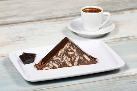 Chocolate cake slice with white icing